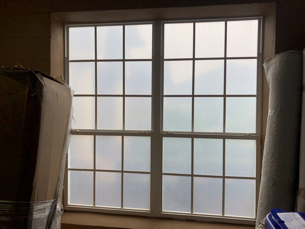 Residential window tinting with frosted privacy film on home windows